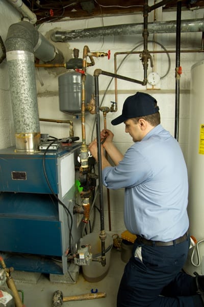 Man fixing the heating system