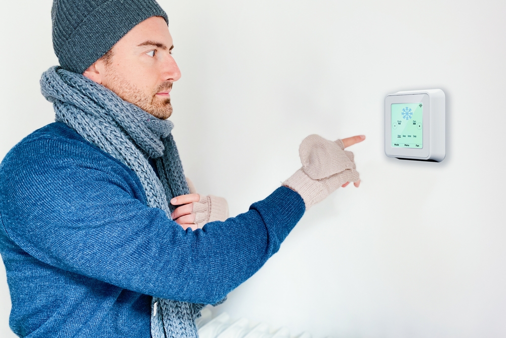Man-turning-on-home-heating